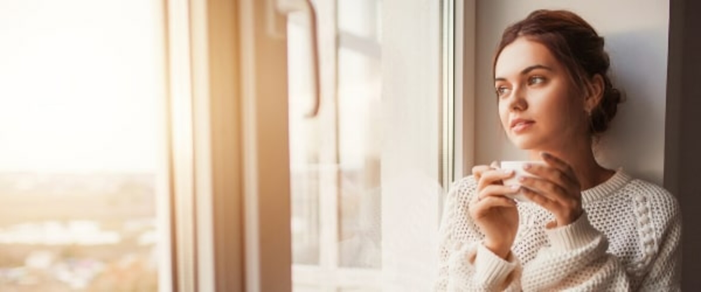 Woman coping during COVID with a tea