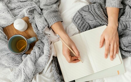 Woman writing in notebook